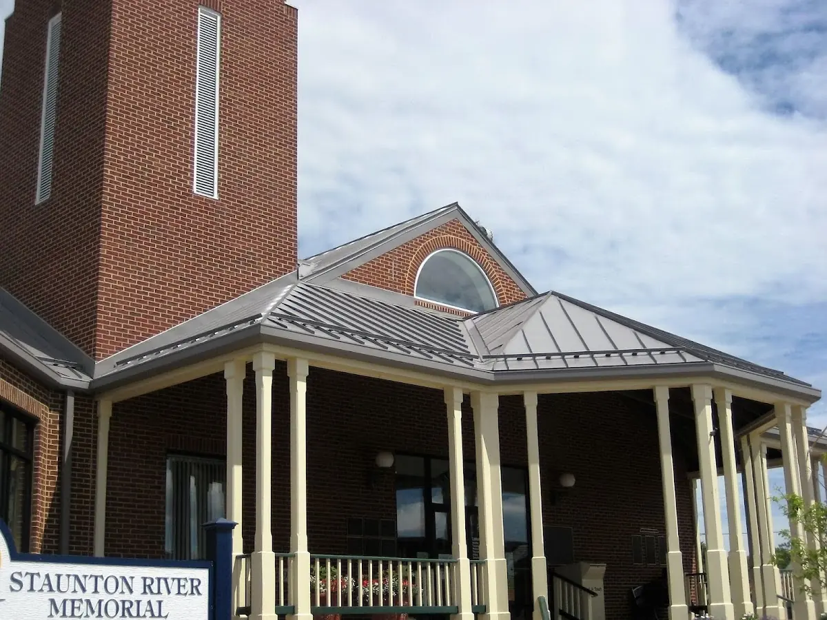 Skilled roofing craftsmen working on a residential roof in Brookside Village